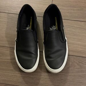 Van’s Black leather runners.